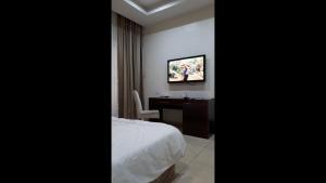 En eller flere senge i et værelse på Room in Lodge - Full Moon Hotel Owerri
