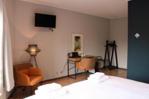 Postel nebo postele na pokoji v ubytování HOLT Hotel