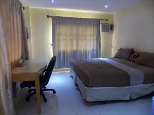 En eller flere senge i et værelse på Room in Lodge - Mikagn Hotels and Suites