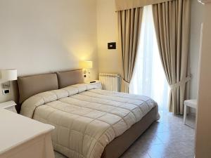 Postel nebo postele na pokoji v ubytování Hotel Ristorante Colleverde