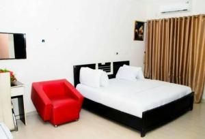 Krevet ili kreveti u jedinici u objektu Room in Lodge - Prescott Hotel Asaba,