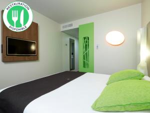 Postel nebo postele na pokoji v ubytování Campanile Lille Euralille