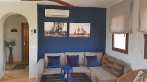 A seating area at Attic apartment in Vera Beach with wifi and air-conditioning
