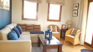 A seating area at Attic apartment in Vera Beach with wifi and air-conditioning