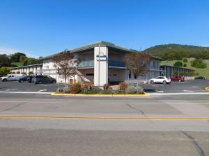 an empty parking lot in front of a building at Days Inn by Wyndham Novato/San Francisco in Novato