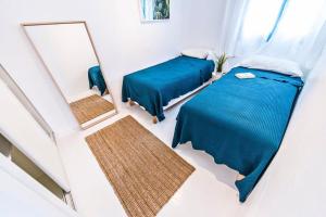 Posteľ alebo postele v izbe v ubytovaní Apartamentos Cotillo Surf