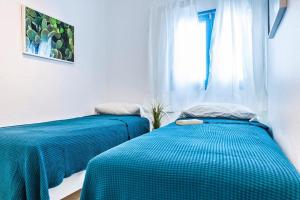 Posteľ alebo postele v izbe v ubytovaní Apartamentos Cotillo Surf