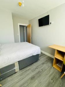 Ліжко або ліжка в номері Cranmore Guest House