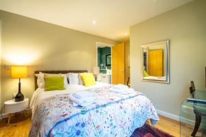 a bedroom with a large bed with towels on it at 15 Stonegate Court in York