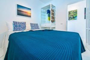 Posteľ alebo postele v izbe v ubytovaní Apartamentos Cotillo Surf