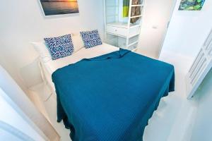 Posteľ alebo postele v izbe v ubytovaní Apartamentos Cotillo Surf