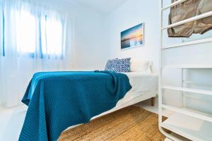 Posteľ alebo postele v izbe v ubytovaní Apartamentos Cotillo Surf