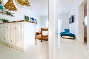 Televízia a/alebo spoločenská miestnosť v ubytovaní Apartamentos Cotillo Surf