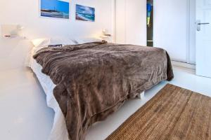 Posteľ alebo postele v izbe v ubytovaní Apartamentos Cotillo Surf