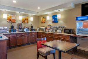 a large kitchen with a table and a counter at Comfort Inn Roseburg in Roseburg
