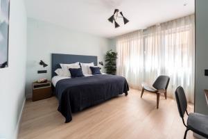 Posteľ alebo postele v izbe v ubytovaní Real Segovia Apartments by Recordis Hotels