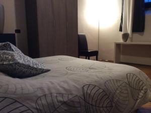 Postel nebo postele na pokoji v ubytování Le Muse