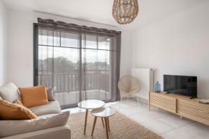 TV a/nebo společenská místnost v ubytování Appartement pour 4 avec vue mer à Pléneuf