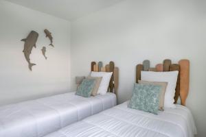 Ліжко або ліжка в номері Votre appartement en bord de plage de Val Andre