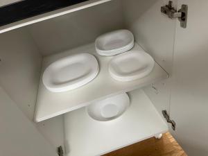 a bathroom with two white urinals on a shelf at Royal Residence Apartmani 2 in Pančevo +12 photos