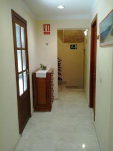 a room with a sink and a door at My Rooms Manacor Centre by My Rooms Hotels in Manacor