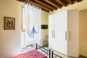 En eller flere senge i et værelse på Pinzochere PT