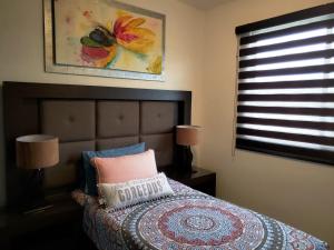 Postel nebo postele na pokoji v ubytování Casa con Alberca a solo 5 minutos de Playas de Nuevo Vallarta RBL33