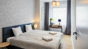 Posteľ alebo postele v izbe v ubytovaní Finale Apartments