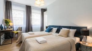 Posteľ alebo postele v izbe v ubytovaní Finale Apartments