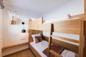 Posteľ alebo postele v izbe v ubytovaní Moose Lodge