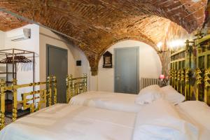 Postel nebo postele na pokoji v ubytování Ca' Monteggia Guest House