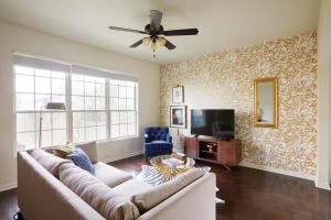 a living room with a couch and a tv at Sonder Tremé in New Orleans
