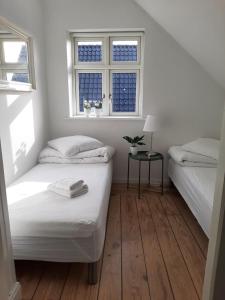 מיטה או מיטות בחדר ב-LatterLy Rooms
