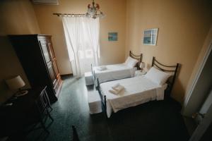 Llit o llits en una habitació de Piazza Argento