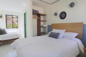Letto o letti in una camera di Soy Local Guatape