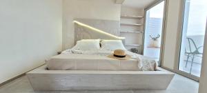 a bedroom with a bed with a hat on it at Villaggio Camping Oasi in Vieste