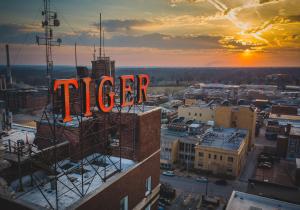 a neon sign that says uber on top of a building at voco The Tiger Hotel, Columbia, MO by IHG in Columbia