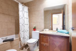 a bathroom with a toilet and a sink and a shower at Lets Holidays Terrace Barcelona in Barcelona +29 photos