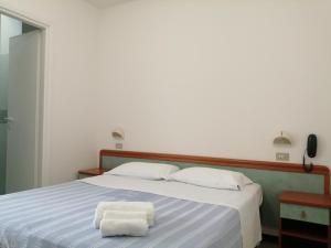 Postel nebo postele na pokoji v ubytování Hotel Derby
