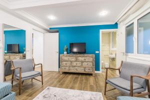 Telewizja i/lub zestaw kina domowego w obiekcie Colon Zurriola IB Apartments