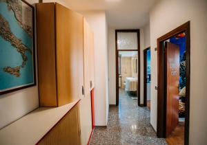 a corridor of a room with a hallway at L'Isola che non c'è in Senigallia +35 photos