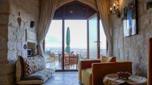 TV a/nebo společenská místnost v ubytování Pigeon Hotel Cappadocia