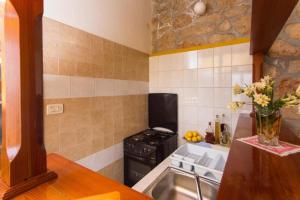 Kuchyň nebo kuchyňský kout v ubytování Guest House Simunovic