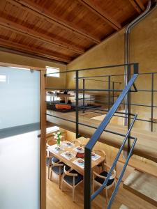 a bunk bed in a room with a table and a staircase at Dorotheou House in Chania