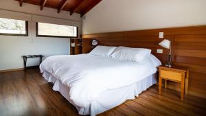 En eller flere senge i et værelse på Andino Aparts - El Chaltén