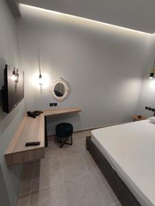 Postel nebo postele na pokoji v ubytování Stefani apartments