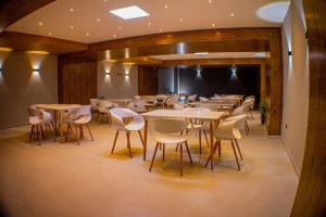 a restaurant with tables and chairs in a room at Harmony Hotel in Ipiales +28 photos