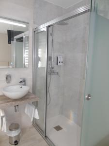 a bathroom with a shower and a sink at Casa San Nicolás in Portomarin