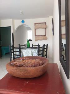a table with a bowl on top of a table at Hermoso Apartamento en San Gil in San Gil