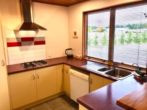 a kitchen with a sink and a counter top at The Snug in Twizel